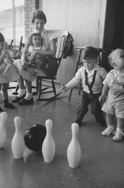 A youngster playing with plastic ball an