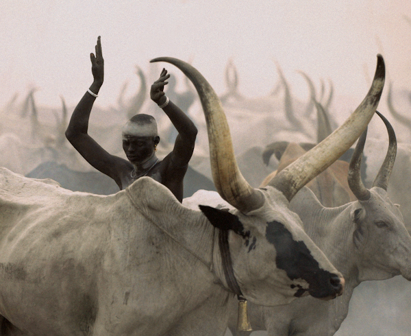 Dinka Man Imitating Horns