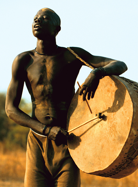 Dinka Man Playing Drum