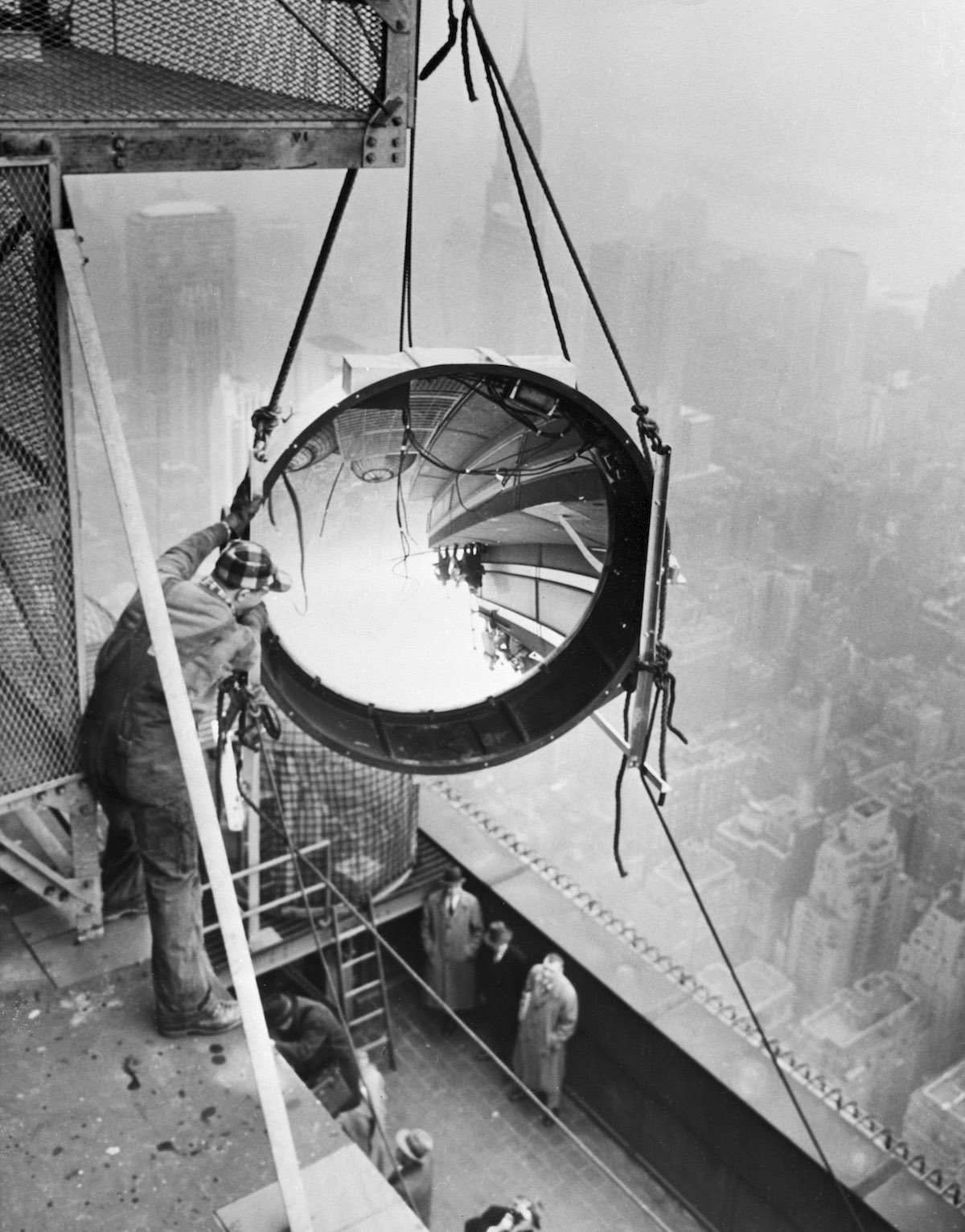 Workmen Install Light On Empire State