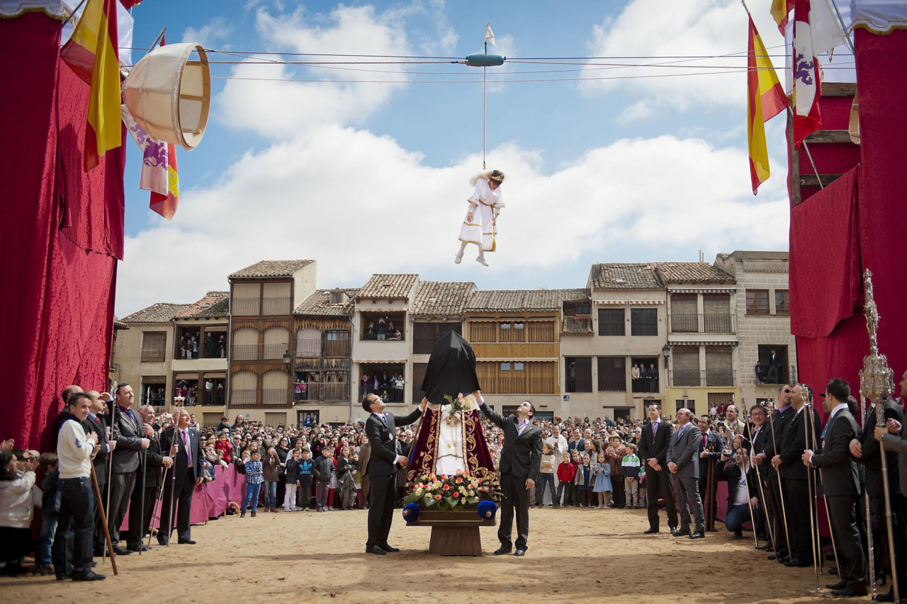 Pablo Leal Requejo plays the role of an angel during the 'Bajada del Angel' Eastern Holy Week celebration in Penafiel, Spain, Sunday, April 8, 2012. During the 'Bajada del Angel' celebration a boy represents an angel appearance unveiling the Virgin's face from a black cloth, a sign of mourning for the death of Jesus, and announces the resurrection of Christ.(AP Photo/Daniel Ochoa de Olza)