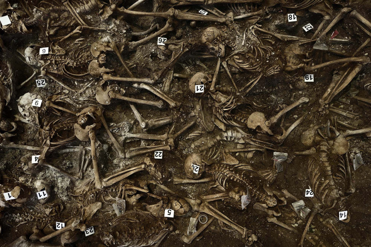 In this July 26, 2014 file picture skeletons are numbered on what it was a hidden mass grave during an excavation by the Aranzadi Sciences Society searching for the remains of those killed by their political ideology during and after the spanish civil war in El Estepar, Spain.(AP Photo/Daniel Ochoa de Olza)