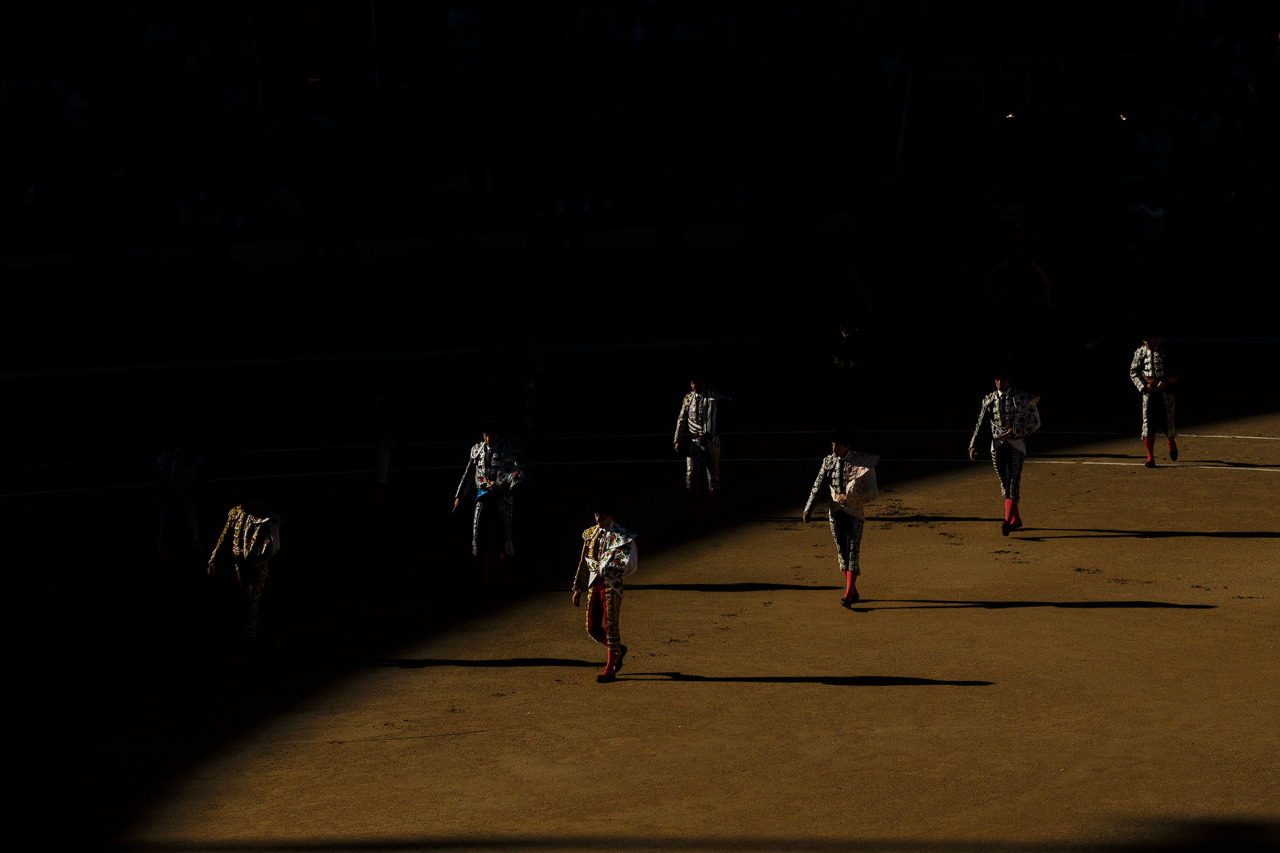 Bullfighters followed by their assistants walk trough the arena during the 'paseillo' or ritual entrance to the arena before a bullfight of the San Isidro fair in Madrid, Spain, Thursday, May 21, 2015. San Isidro's bullfighting fair is one of the most important in the world. Bullfighting is an ancient tradition in Spain. (AP Photo/Daniel Ochoa de Olza)
