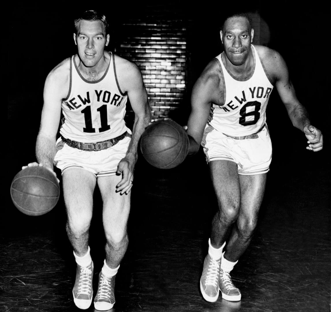 NEW YORK - 1950: Harry Gallatin #11 and Nathaniel Clifton #8 of the New York Knicks pose for a mock action portrait circa 1950 in New York, New York. NOTE TO USER: User expressly acknowledges and agrees that, by downloading and/or using this Photograph, user is consenting to the terms and conditions of the Getty Images License Agreement. Mandatory Copyright Notice: Copyright 1950 NBAE (Photo by NBA Photo Library/NBAE via Getty Images)