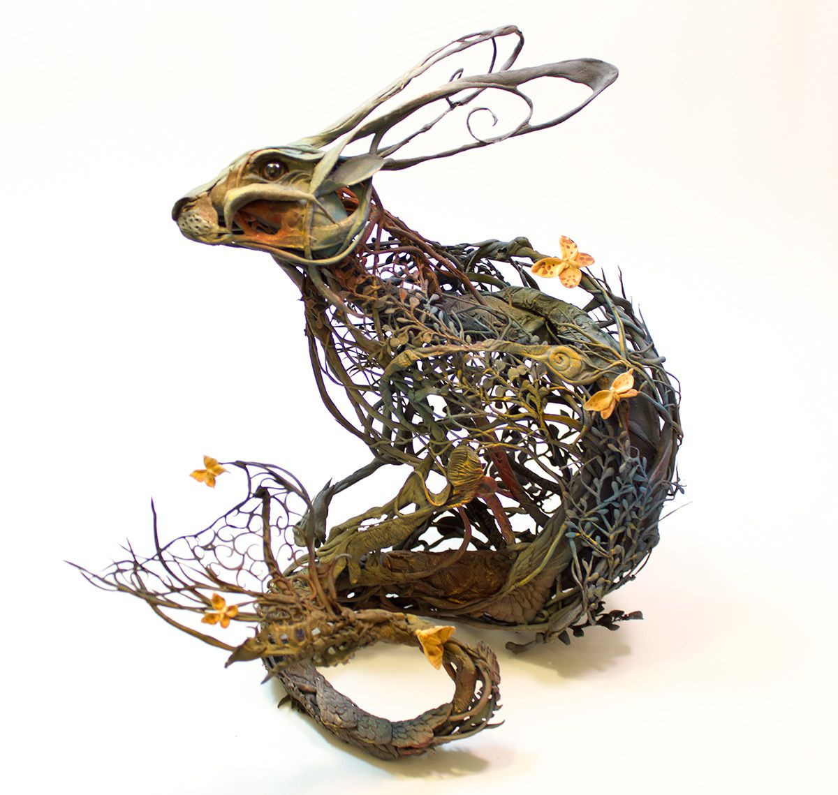 escultura de un conejo hecha con plantas