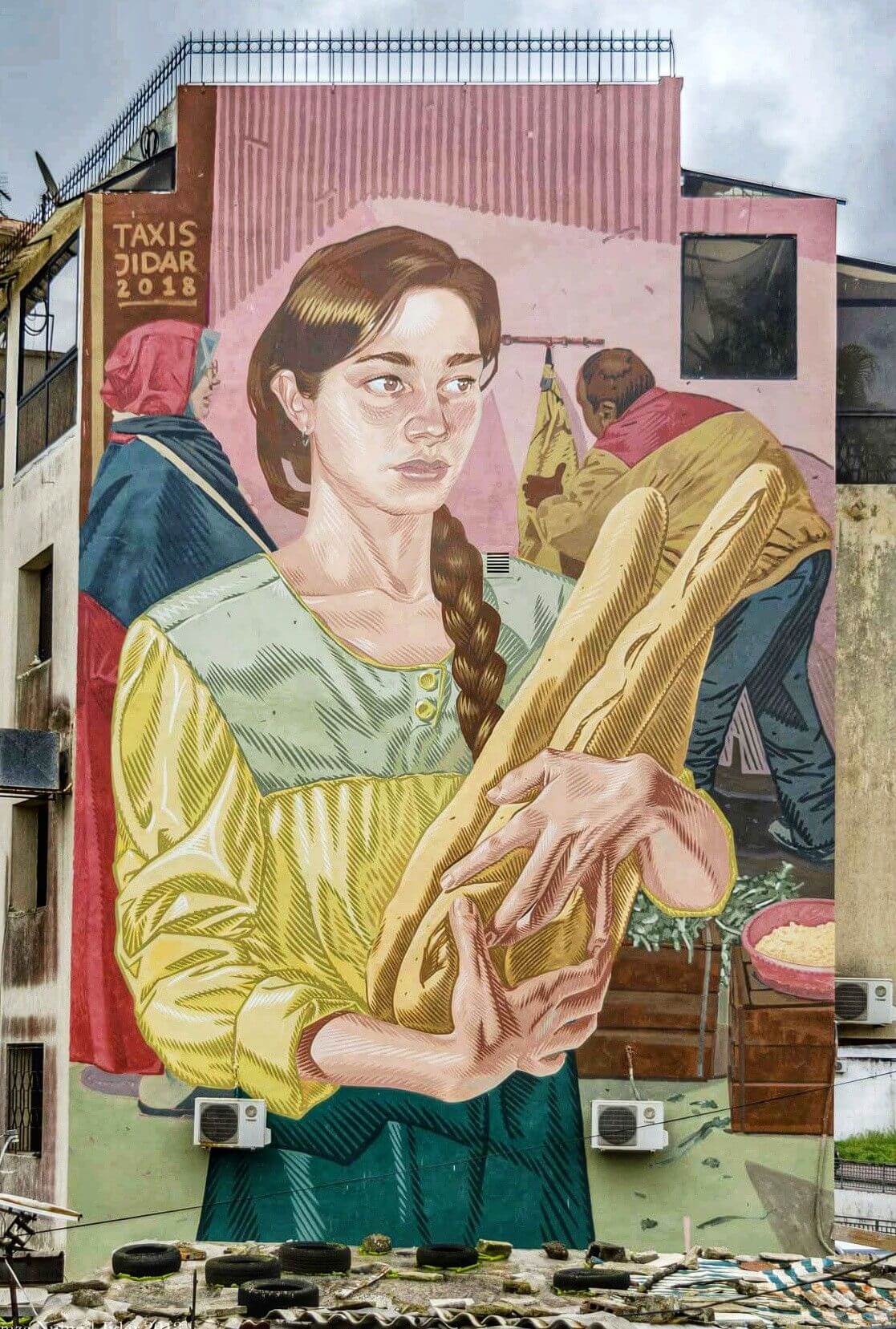 Mujer con pan, graffiti estilo cÃ³mic de Dimitris Taxis