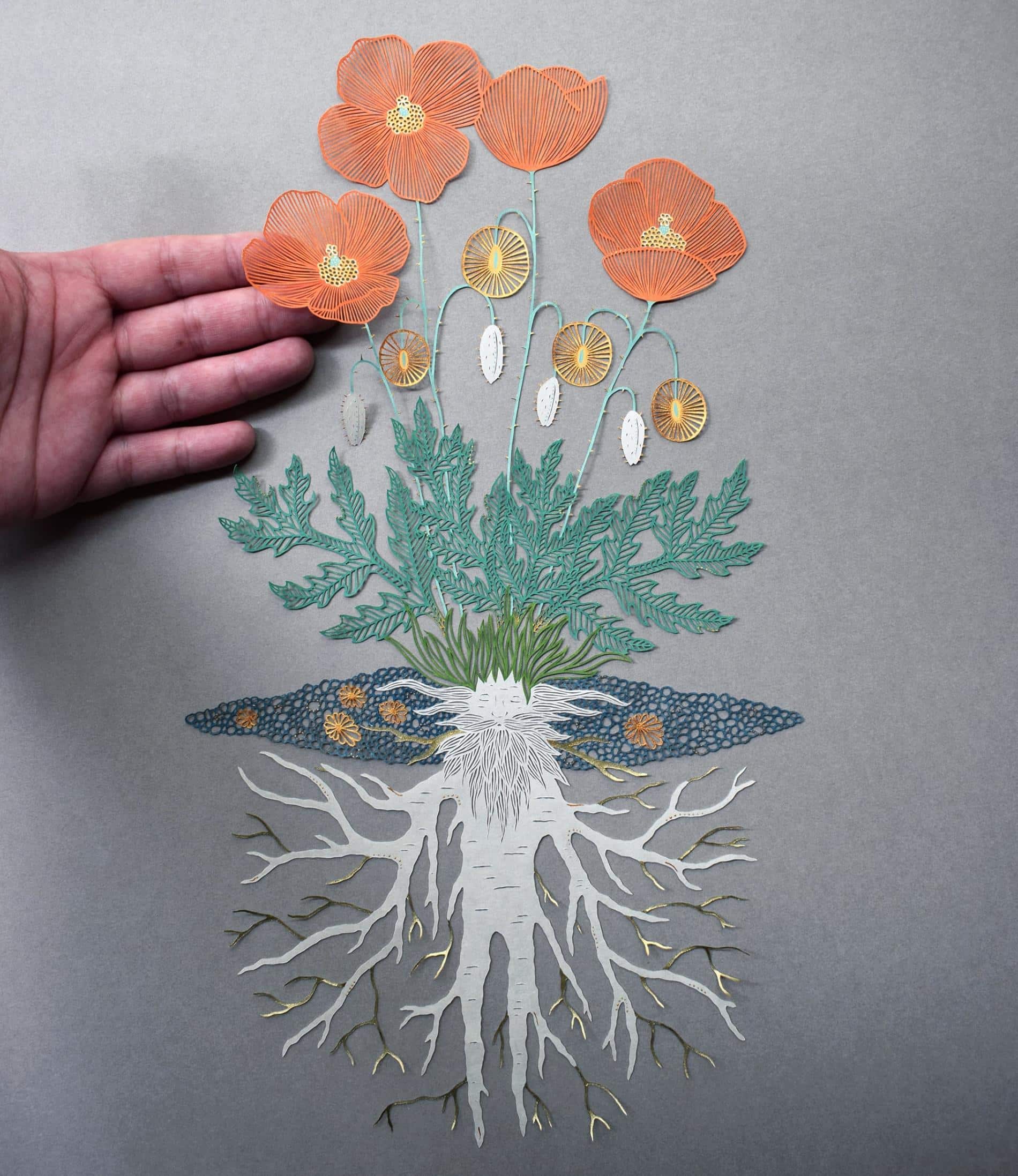 flores y raices en la obra de papel cortado de pippa dyrlaga