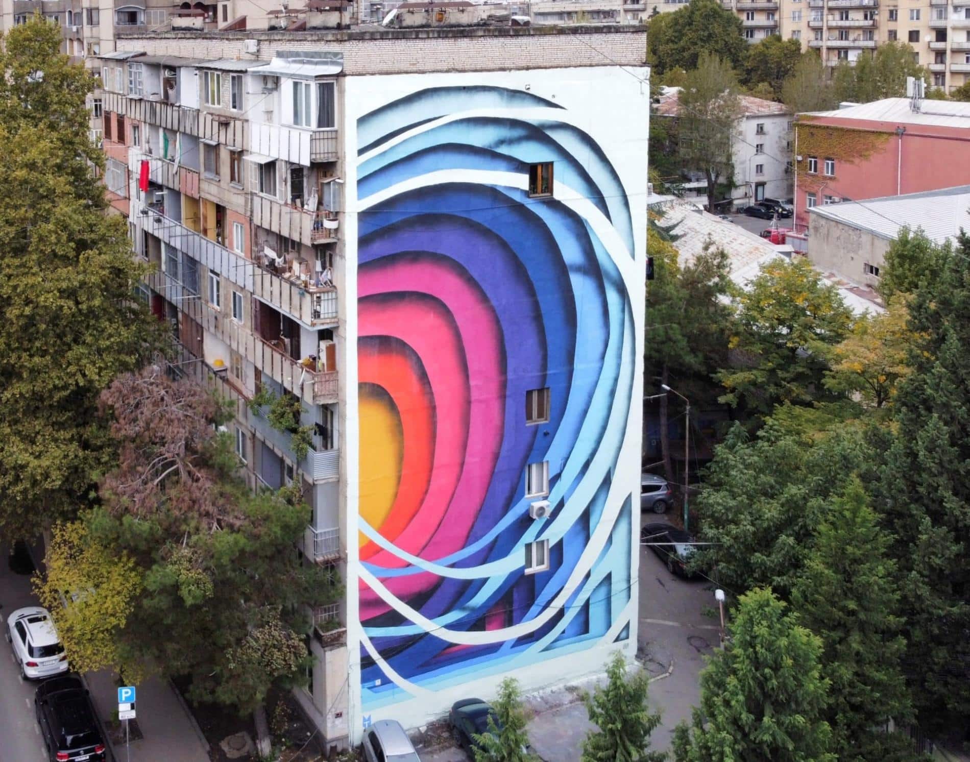 mural de ilusion optica com,o papel recortado de colores de 1010